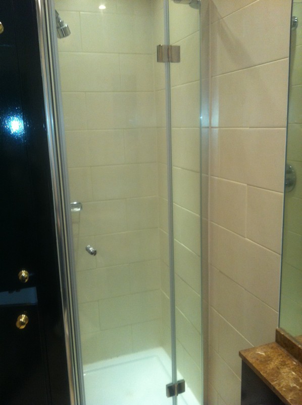 Frameless glass shower enclosure with chrome fittings in Barnet